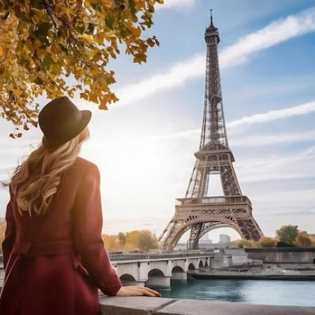 young-woman-looking-view-eiffel-tower-paris-autumn_926199-2522561